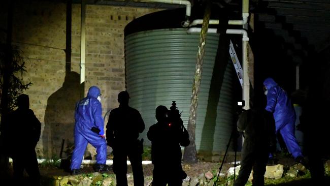 Forensic services at the front garden of the former home of William Tyrrell. Picture: AAP Image/Mick Tsikas