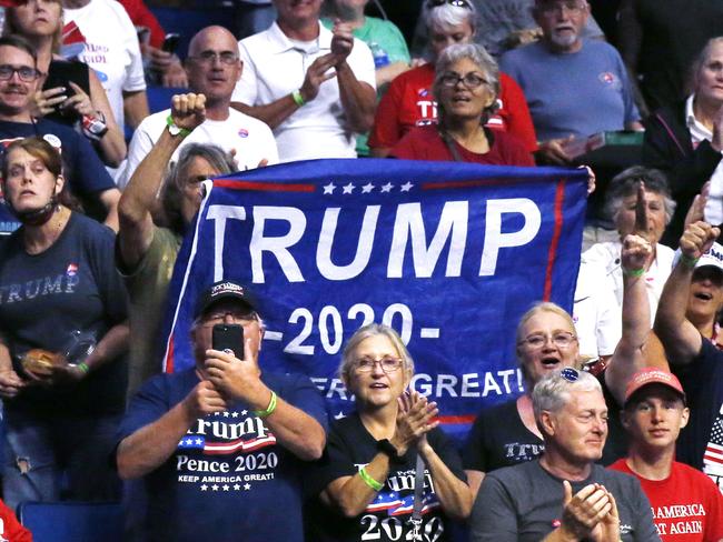 President Donald Trump supporters cheer Eric Trump, the son of President Donald Trump, not pictured, before a Trump campaign rally in Tulsa, Okla., Saturday, June 20, 2020. (AP Photo/Sue Ogrocki)