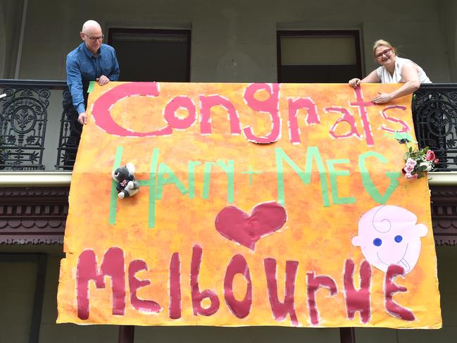 David McBain and Kim Tonelli put a sign on their house for Prince Harry and Meghan. Picture: Jay Town