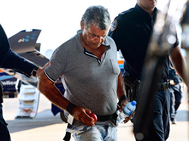 The hunt for convicted axe murderer and rapist Edward James Horrell finished this morning when police located him in   bushland around the Nhulunbuy township. Pictured in Darwin after been flown back by Police.