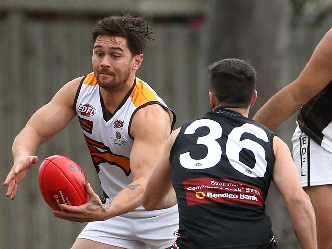 Jesse Davies of Craigieburn (left) under pressure from Steven Mete of West Coburg during EDFL footy: West Coburg v Craigieburn on Saturday, July 27, 2019, in West Coburg, Victoria, Australia. Picture: Hamish Blair