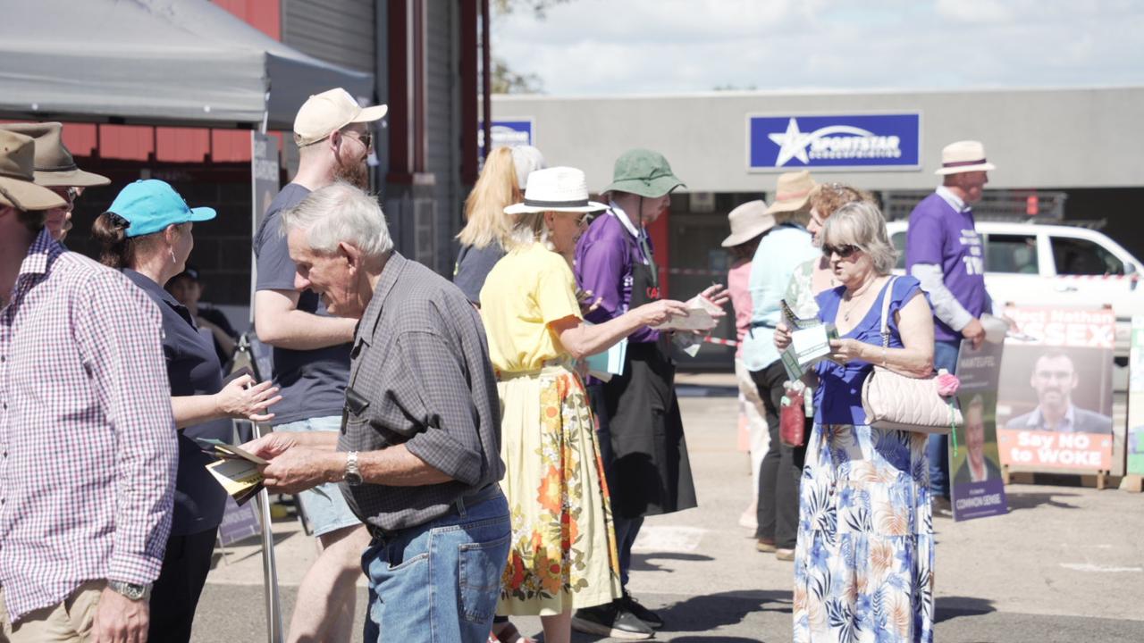 People line to collect candidate material ahead of voting at the 2024 local government elections at the Toowoomba pre-polling centre on Hill Street in Newtown.