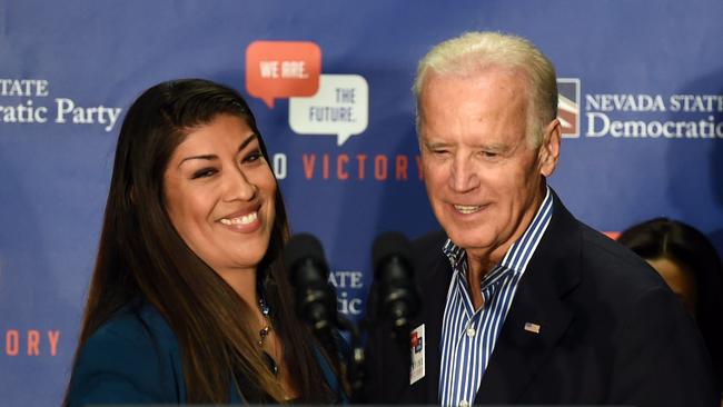 (FILES) In this file photo taken on November 1, 2014 former Democratic candidate for lieutenant governor and current Nevada Assemblywoman Lucy Flores (D-Las Vegas) (L) introduces former US Vice President Joe Biden at a get-out-the-vote rally at a union hall  in Las Vegas, Nevada. - Former vice president Joe Biden insisted on March 31, 2019 he had never acted inappropriately towards women as a growing row about a kiss on the campaign trail cast a shadow over his expected run for the White House.The 76-year-old Biden is the clear favorite to win the Democrat nomination to take on Donald Trump in the 2020 presidential election even though he has yet to declare his candidacy. (Photo by Ethan Miller / GETTY IMAGES NORTH AMERICA / AFP)