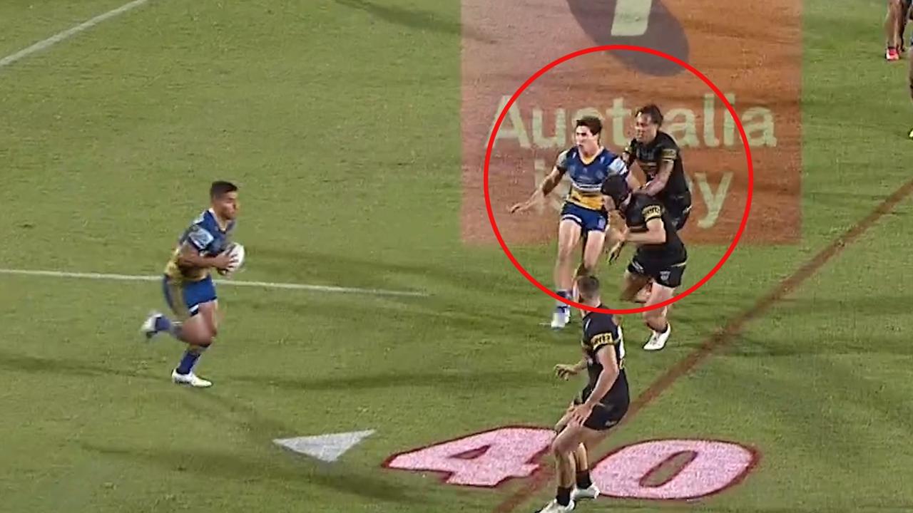 Mitch Moses is held back by Jarome Luai.