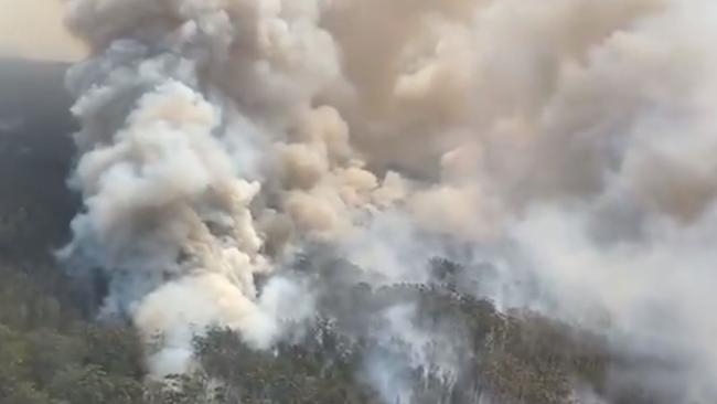 Difficult firefighting conditions on the Hillville Fire, south of Taree. This is the fire burning near Diamond Beach. The fire is at Emergency Warning level. Picture: RFS