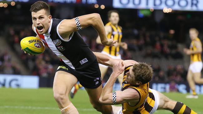 St Kilda’s Rowan Marshall breaks the tackle of Hawthorn’s Ben McEvoy.