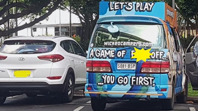 An offensively decorated Wicked Campers van parked on the Cairns Esplanade pronounces: "Let's play a game of f*** off. You go first." The yellow shape blocking the offending word has been digitally added. PICTURE: CHRIS CALCINO