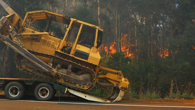 Heavy machinery including bulldozers are sitting idle due to a lack of contract work in Victorian forests.