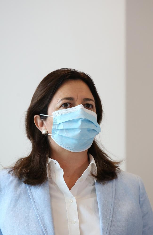 Queensland Premier Annastacia Palaszczuk is seen wearing a mask during a press conference. (Photo by Jono Searle/Getty Images)