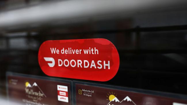 DoorDash is valued at $US56 billion, just shy of General Motors Co. Airbnb is worth over $US83 billion, more than FedEx Corp. Picture: AFP