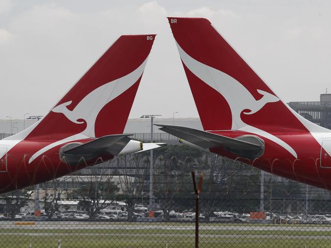 SYDNEY, AUSTRALIA - NewsWire Photos February 25, 2021: QANTAS has reported losses of around 1 billion dollars over the last year, counting the financial cost of Covid-19 on the airline. QANTAS planes are pictured at Sydney Airport today. Picture: NCA NewsWire / David Swift