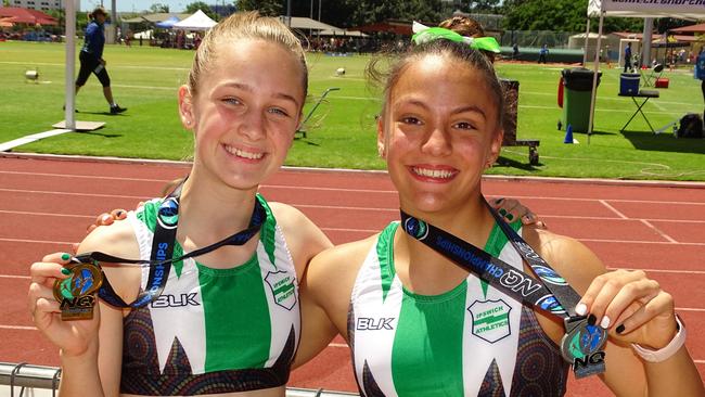 Ipswich and District Athletic Club medal winners Acacia Wohlsen and Addison Farinazo in Townsville. Picture: Vic Pascoe