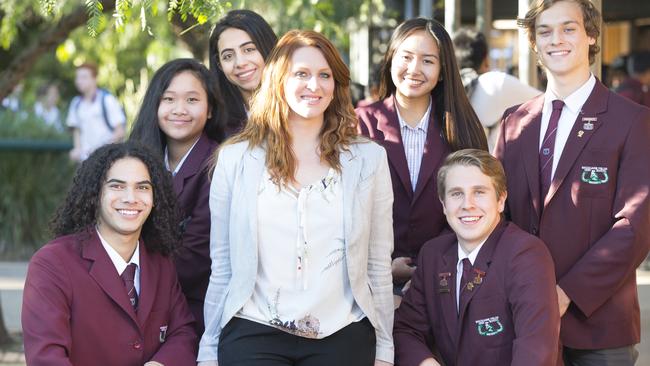 Teacher Marinda Barnes celebrates her win with her students at Macquarie Fields High School. Picture: Melvyn Knipe