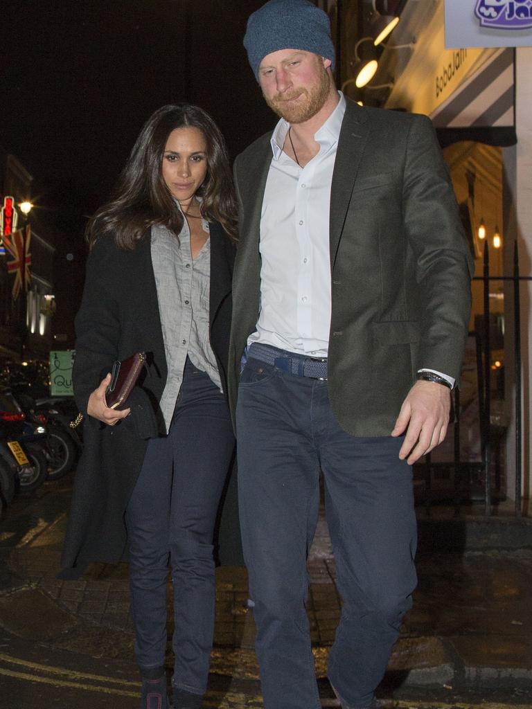 Harry walking down the street in London with then-girlfriend Meghan Markle. Picture: FameFlynet/Backgrid