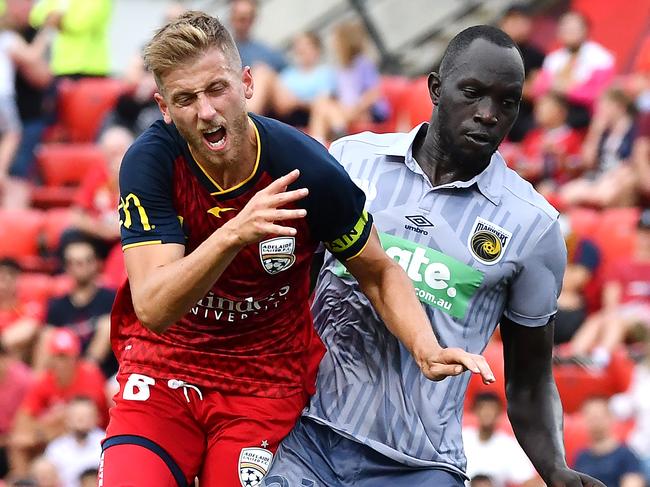 ADELAIDE, AUSTRALIA - FEBRUARY 19:  Stefan Mauk of Adelaide United  is fouled by Ruon Tongyik of the Mariners resulting in a penalty during the A-League match between Adelaide United and the Central Coast Mariners at Coopers Stadium, on February 19, 2021, in Adelaide, Australia. (Photo by Mark Brake/Getty Images)