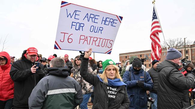 Trump supporters hold signs outside the DC Central Detention Facility where some defendants from the January 6, 2021, attack on the US Capitol were held, after US President Donald Trump signed pardons for Capitol rioters. Picture: AFP