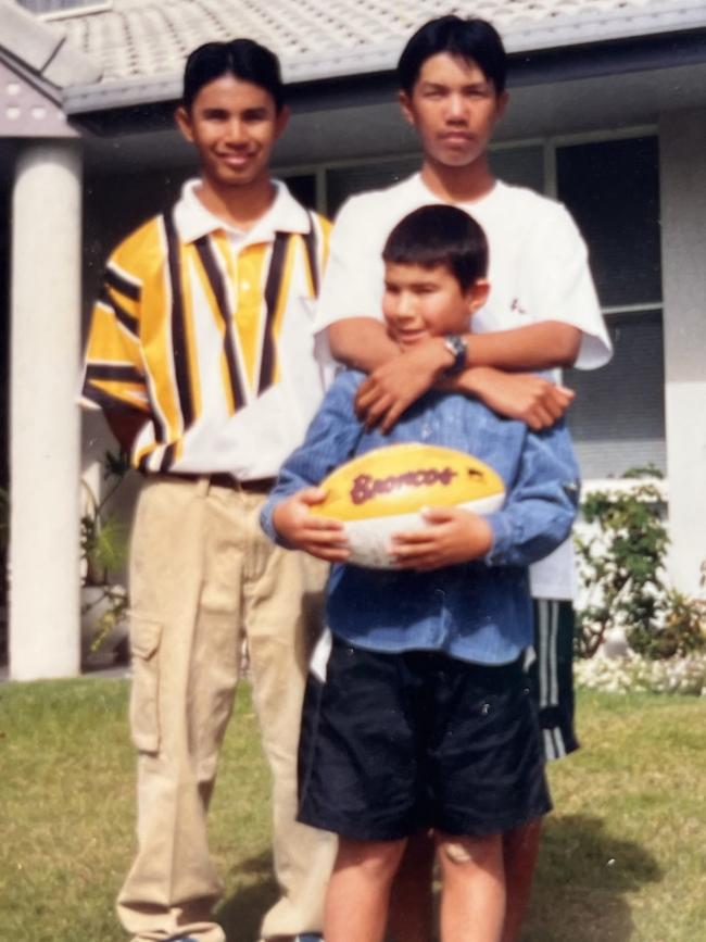 Anuisha Bone as a young boy with his older brothers Orl and Aek.