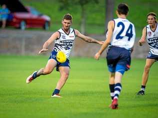 FLYING HIGH: Jesse Lawrence (kicking) bagged 8 majors in a scintillating performance against Maryborough last weekend. Picture: Leeroy Todd