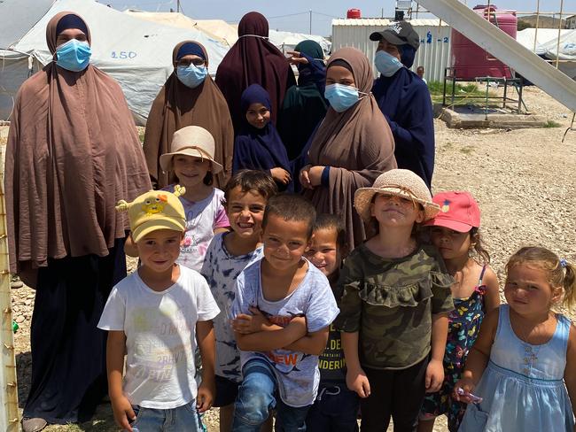 Australian women and children at al-Roj camp in northeastern Syria. The woman are (L-R) Mariam Dabboussy, Aminah Assaad, Nesrine Zahab (she has her back turned, tall one at the back), Shayma Assaad and Bessima Assaad (Bessima is in the black cap) Children are (L-R) Abdul Rahman (first left), son of Nesrine Zahab, Alaa & Umayr (third and fourth from left), sons of Shayma Assaad, and far right Mariam, daughter of Shayma Assaad.Picture: Ellen Whinnett / The Australian