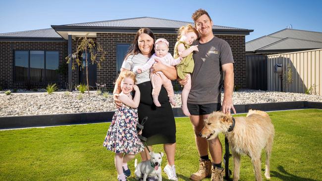 Mathew Lane and his wife Ashlee built their Horsham home only 12 months ago, and are now upsizing. They are pictured with their three children, Imogen (4), Clara (2) and Romy (5 months), and dogs Marley, a stag hound and Milla, a fox terrier. Picture: Mark Stewart