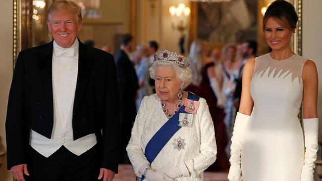 Queen Elizabeth II, centre, Donald Trump and US First Lady Melania Trump pose for a photograph ahead of a State Banquet for the visiting President at Buckingham Palace. Picture: AFP