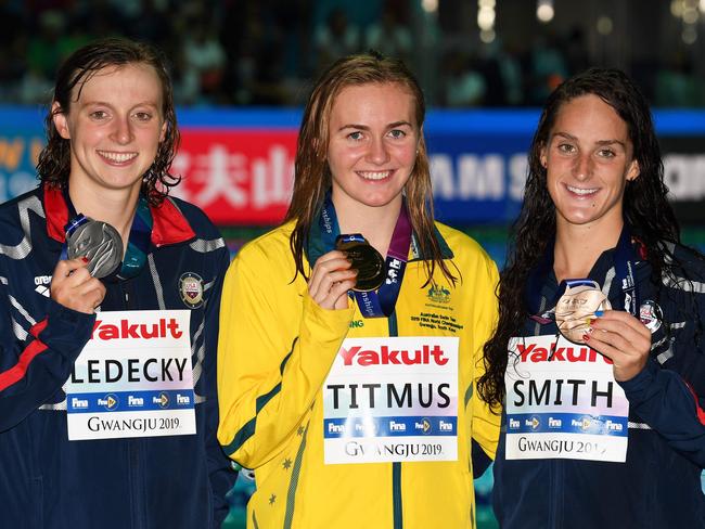 Gold medallist Australia's Ariarne Titmus (C), silver medallist USA's Katie Ledecky (L) and bronze medallist USA's Leah Smith pose with their medals after the final of the women's 400m freestyle event during the swimming competition at the 2019 World Championships at Nambu University Municipal Aquatics Center in Gwangju, South Korea, on July 21, 2019. (Photo by Oli SCARFF / AFP)