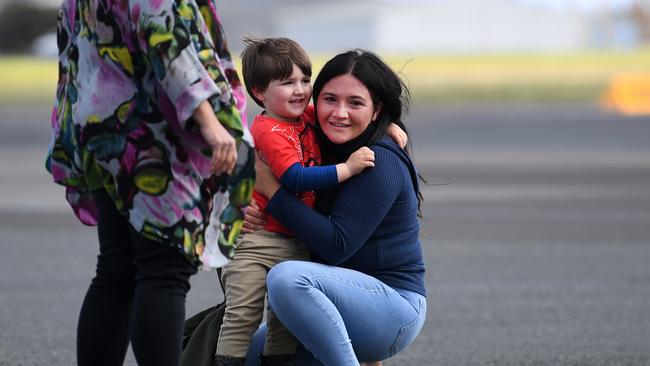 Three-year-old Memphis Francis is reunited with his family at Archerfield airport, after arriving from Griffith in NSW on a special flight. Memphis was stranded in NSW for a number of weeks due to border closures. Picture: Dan Peled/NCA NewsWire