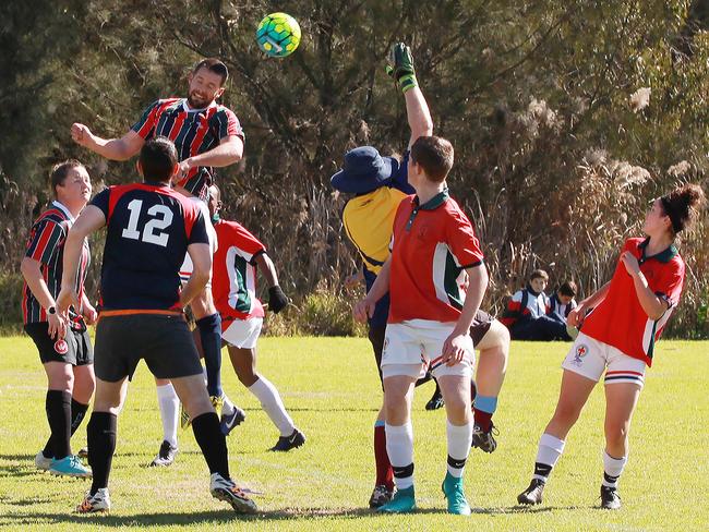 Teachers have the higher reach in this goalmouth tussle.