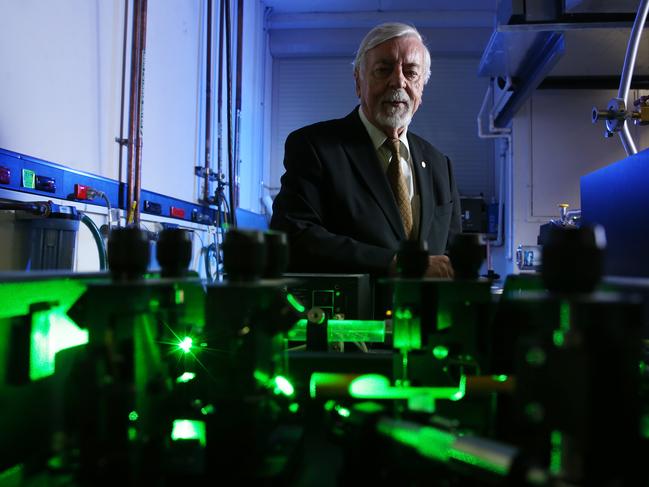 20/02/2020. German physicist Heinrich Hora pictured with high power laser technology in the photonics and opto-electronics research lab, School of Physics at UNSW in Sydney. His research is core to UNSW Sydney spin-out company, HB11 Energy, which has been granted patents for its laser-driven technique for creating clean fusion energy. Britta Campion / The Australian