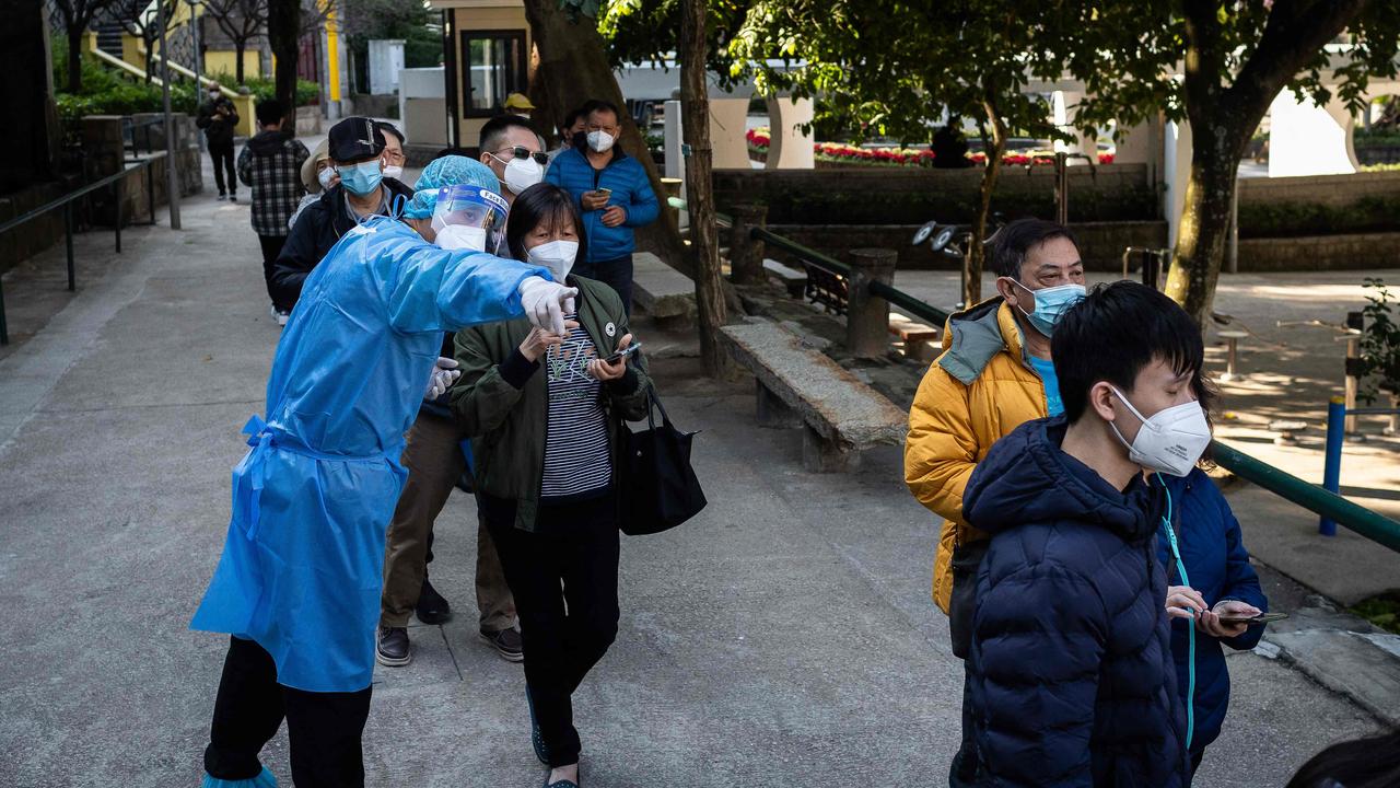 People queue for a Covid-19 test in Macau as China’s relaxing of pandemic restrictions sees a huge wave of cases. Picture: Eduardo Leal/AFP