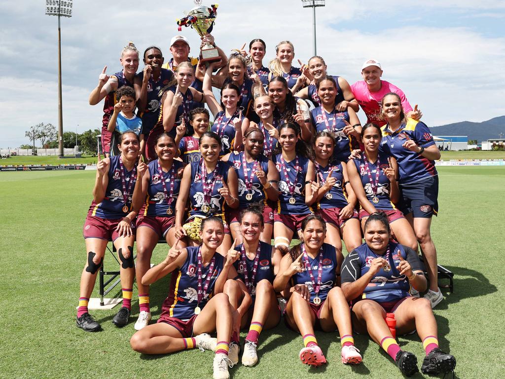 Cairns City Lions players celebrate winning the AFL Cairns women's grand final match, defeating the North Cairns Tigers at Cazalys Stadium, Westcourt. Picture: Brendan Radke