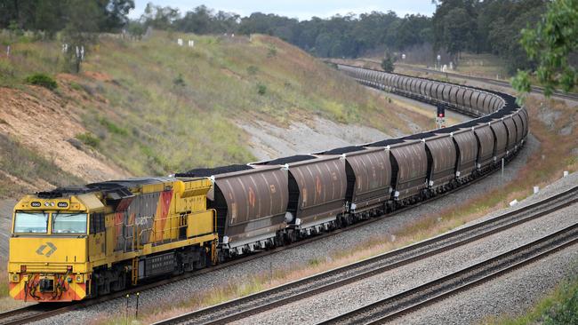 Loaded coal trains will run past Brisbane and Logan homes via the Inland Rail route. Photo: AAP/Dan Himbrechts