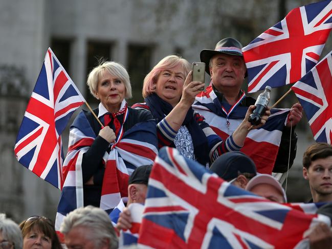 TOPSHOT - Pro-Brexit supporters holding Union flags attend a rally in central London on March 29, 2019, organised by Leave Means Leave. - British MPs on Friday rejected Prime Minister Theresa May's EU divorce deal for a third time, opening the way for a long delay to Brexit -- or a potentially catastophic "no deal" withdrawal in two weeks. (Photo by Daniel LEAL-OLIVAS / AFP)