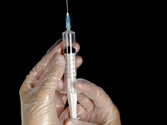 Hand with syringe. Needle. generic