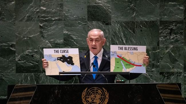 Israeli Prime Minister Benjamin Netanyahu holds up maps of the Middle East during his address to the UN General Assembly. Picture: Stephanie Keith/Getty Images via AFP