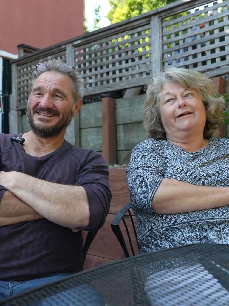 Christopher Guilbert and Solange Brill chat about politics at a coffee shop in Brisbane, California.