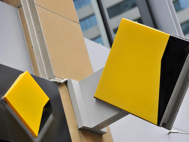 A file image of Commonwealth Bank of Australia (CBA) bank signage in Sydney, Friday, Oct. 23, 2015. CBA has agreed to pay $700 million to resolve proceedings brought by AUSTRAC after admitting to breaching anti-money laundering and counter-terrorism laws. (AAP Image/Joel Carrett) NO ARCHIVING