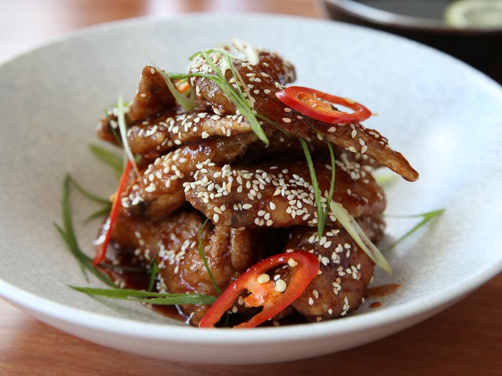 <span class="h2">Chur Burger</span>                  <b>20 Constance St, Fortitude Valley. Price: $14 for a serve (roughly seven).</b> Burgers are the main trade at Chur, with Korean fried chicken wings featuring as a tasty side snack. They arrive as whole wings, tips intact, scattered with sesame seeds, chilli and shallots.   The wings have the same shattering crunch and sticky-sweet glaze of usual Korean-style fried chicken, but the meat is more tender from being cooked on the bone. They also score bonus points for being the only venue we visited that provided a finger bowl, and for the excellent range of hot­  sauces on offer. <b><a href="http://www.churburger.com.au/brisbane" title="www.churburger.com.au">More details</a></b>