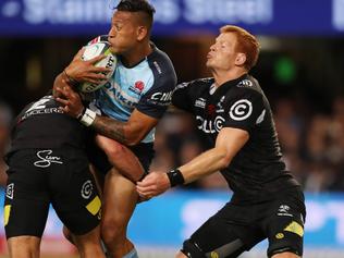 DURBAN, SOUTH AFRICA - MARCH 11: Israel Folau of the NSW Waratahs tackled by Franco Marais and Philip van der Walt of the Cell C Sharks during the Super Rugby match between the Cell C Sharks and Waratahs at Growthpoint Kings Park on March 11, 2017 in Durban, South Africa. (Photo by Steve Haag/Gallo Images/Getty Images)