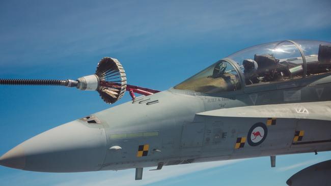 A RAAF F-18 Hornet refuels over the Northern Territory during Exercise Pitch Black at the Royal Australian Air Force Base in Darwin. Picture: AAP.