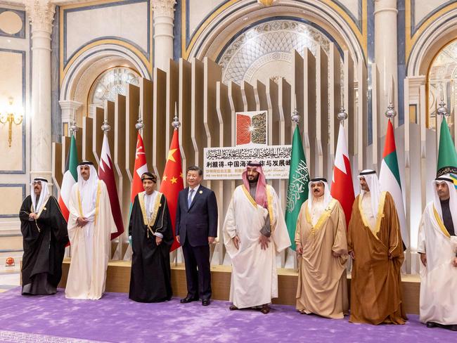 This handout picture released by the UAE Presidential Court shows R to L: Secretary General of the Gulf Cooperation Council Nayef Falah Al Hajraf, UAE Supreme Council Member and Ruler of Fujairah Sheikh Hamad bin Mohamed Al Sharqi, Bahrain's King Hamad bin Isa Al Khalifa, Saudi Crown Prince Mohammed bin Salman, Chinese President Xi Jinping, Omani Deputy Prime Minister for the Council of Ministers Sayyid Fahd bin Mahmoud Al Said, Qatari Emir Sheikh Tamim bin Hamad Al Thani and Kuwaiti Crown Prince Sheikh Mishal Al Ahmad Al Jaber Al Sabah, in Riyadh during the China-Gulf Cooperation Council (GCC) Summit, at King Abdulaziz International Convention Center on December 9, 2022. (Photo by Ryan CARTER / UAE PRESIDENTIAL COURT / AFP) / === RESTRICTED TO EDITORIAL USE - MANDATORY CREDIT "AFP PHOTO / HO / UAE PRESDIENTIAL COURT" - NO MARKETING NO ADVERTISING CAMPAIGNS - DISTRIBUTED AS A SERVICE TO CLIENTS ===