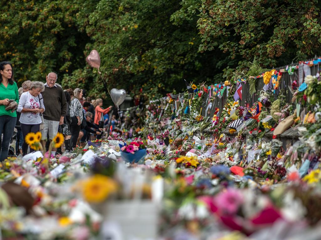 People view flowers and tributes by the Botanical Gardens in Christchurch. Picture: Getty Images