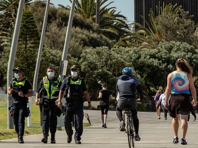 Public Service Officers patrol at St Kilda beach on October 3. Picture: Getty