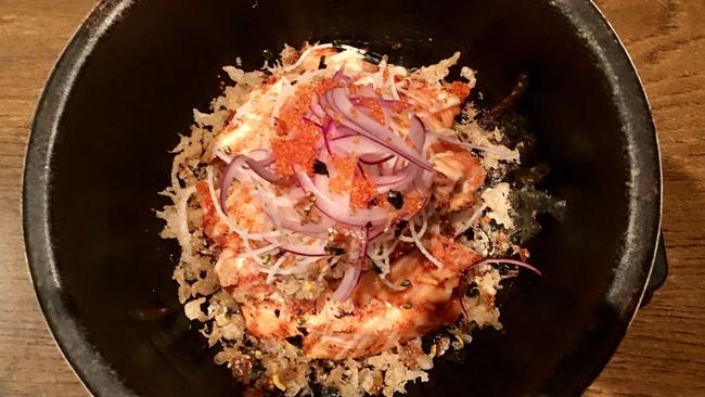 Sizzling salmon on rice.