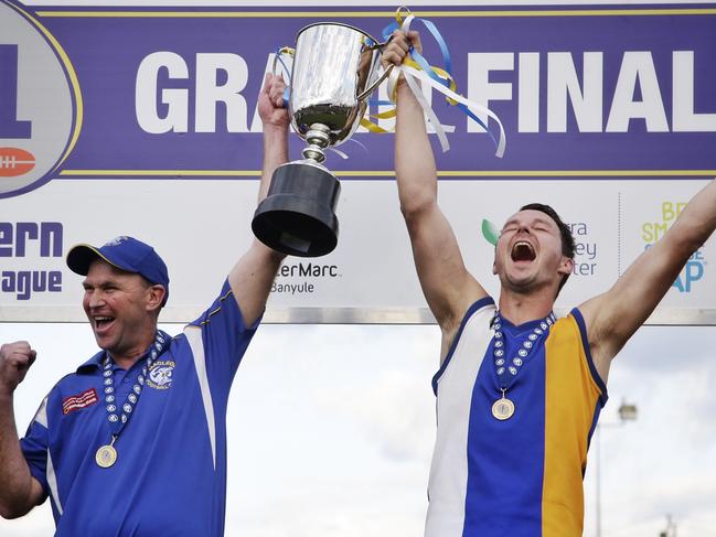 Garry Ramsay (left) celebrates leading Macleod to a drought-breaking flag with captain Kane Shaw in 2015. Picture: Hamish Blair