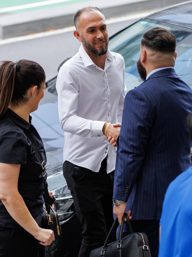 Ali Hamad greets one of his lawyers before court. Picture: Max Mason-Hubers