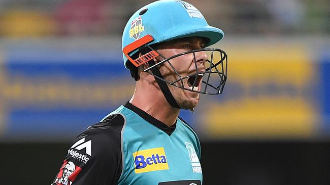 Chris Lynn walks after he is caught out against the Renegades at the Gabba.