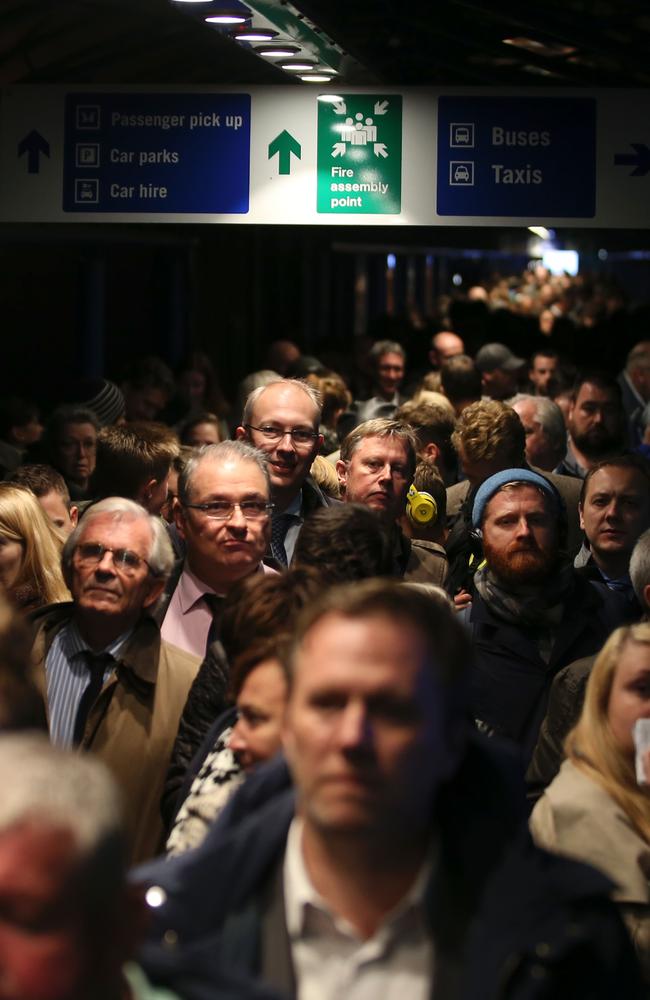 Passengers queue outside the entrance to London's City Airport after an evacuation. Picture: Daniel Leal-Olivas.