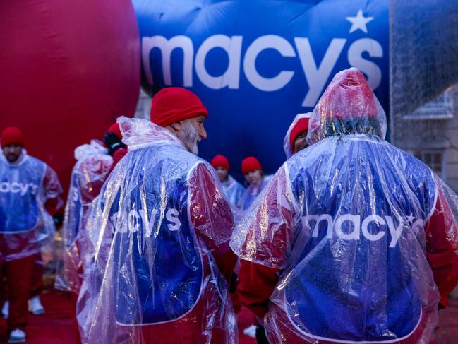 Macys helpers gather as rain falls before the Annual Thanksgiving Day Parade in New York City. Picture: Getty Images via AFP