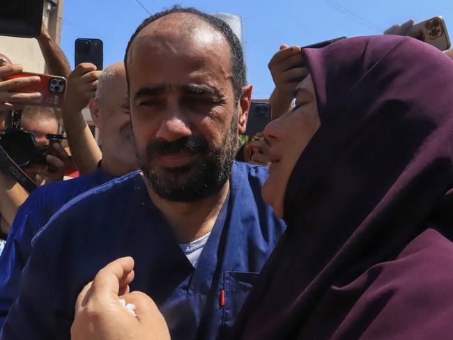 Al-Shifa hospital director Mohammed Abu Salmiya, who was detained by Israeli forces since November, is welcomed by relatives after his release alongside other detainees. Picture: AFP